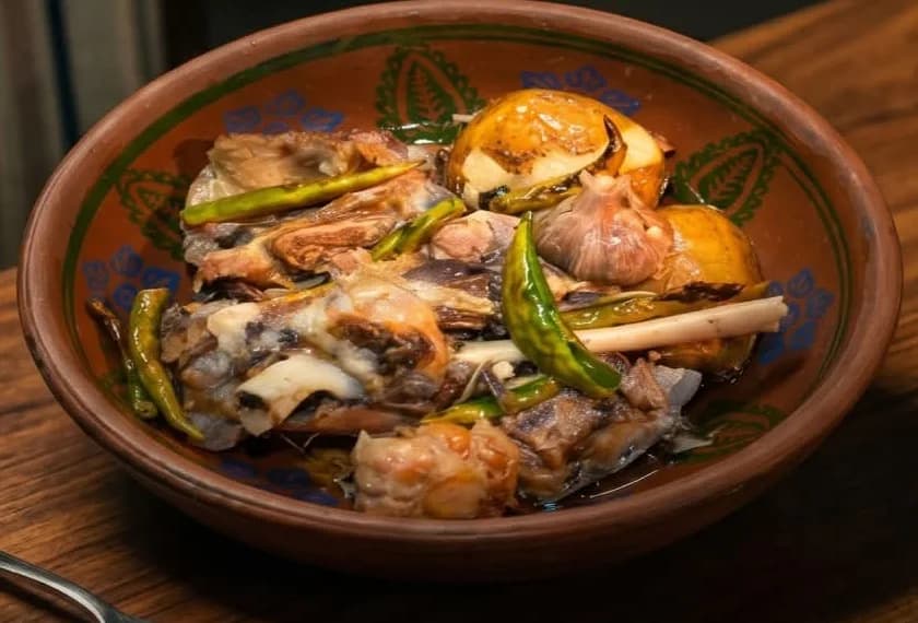 A bone-in meat serving in gravy from the supplied food photographs