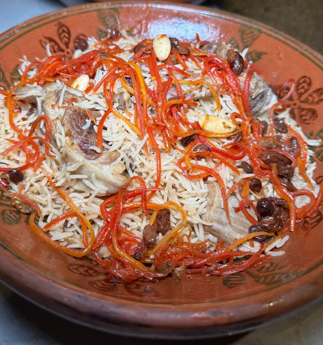A restaurant-supplied photograph of rice with carrots and raisins